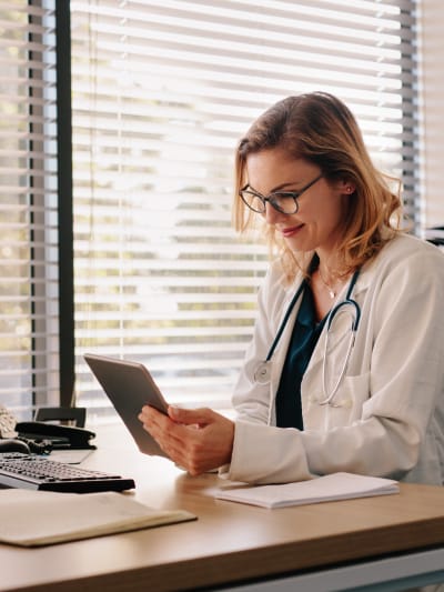 Doctor looking at tablet
